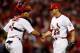 ST LOUIS, MO - OCTOBER 08: (R) Trevor Rosenthal #64 and Yadier Molina #4 of the St. Louis Cardinals celebrate after the Cardinals defeat the Washington Nationals 12-4 in Game Two of the National League Division Series at Busch Stadium on October 8, 2012 in St Louis, Missouri. (Photo by Jamie Squire/Getty Images)