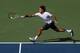 MASON, OH - AUGUST 18: Roger Federer of Switzerland hits a forehand against Stanislas Wawrinka of Switzerland during day eight of the Western & Southern Open at Lindner Family Tennis Center on August 18, 2012 in Mason, Ohio. (Photo by Nick Laham/Getty Images)
