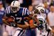 INDIANAPOLIS - JANUARY 24: Wide receiver Reggie Wayne of the Indianapolis Colts runs the ball against Kerry Rhodes #25 of the New York Jets during the second quarter of the AFC Championship Game at Lucas Oil Stadium on January 24, 2010 in Indianapolis, Indiana. (Photo by Jonathan Daniel/Getty Images)