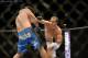 May 26, 2012; Las Vegas, NV, USA; Junior Dos Santos (right) follows through on a right handed punch towards Frank Mir (left) during UFC 146 at the MGM Grand Garden event center. Mandatory Credit: Ron Chenoy-US PRESSWIRE