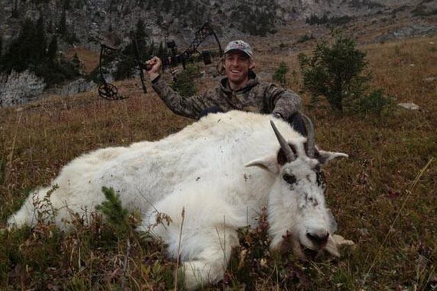 Photo: David Booth Poses with His Latest Hunting Conquest, a Mountain Goat