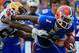 GAINESVILLE, FL - OCTOBER 06: Tharold Simon #24 of the LSU Tigers attempts to tackle Quinton Dunbar #1 of the Florida Gators during the game at Ben Hill Griffin Stadium on October 6, 2012 in Gainesville, Florida. (Photo by Sam Greenwood/Getty Images)