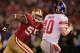 SAN FRANCISCO, CA - JANUARY 22: Ahmad Brooks #55 of the San Francisco 49ers pressures Eli Manning #10 of the New York Giants during the NFC Championship Game at Candlestick Park on January 22, 2012 in San Francisco, California. (Photo by Doug Pensinger/Getty Images)