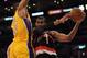 LOS ANGELES, CA - FEBRUARY 20: LaMarcus Aldridge #12 of the Portland Trail Blazers is fouled by Andrew Bynum #17 of the Los Angeles Lakers during the second half at Staples Center on February 20, 2012 in Los Angeles, California. The Lakers won 103-92. NOTE TO USER: User expressly acknowledges and agrees that, by downloading and or using this photograph, User is consenting to the terms and conditions of the Getty Images License Agreement. (Photo by Harry How/Getty Images)