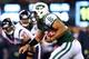 EAST RUTHERFORD, NJ - OCTOBER 08: Tim Tebow #15 of the New York Jets runs for a first down against the Houston Texans at MetLife Stadium on October 8, 2012 in East Rutherford, New Jersey. (Photo by Elsa/Getty Images)