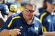 ANN ARBOR, MI - SEPTEMBER 08: Head coach Brady Hoke of the Michigan Wolverines talks to his team on the bench while playing the Air Force Falcons at Michigan Stadium on September 8, 2012 in Ann Arbor, Michigan. Michigan won the game 31-25. (Photo by Gregory Shamus/Getty Images)
