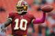 LANDOVER, MD - OCTOBER 07: Quarterback Robert Griffin III #10 of the Washington Redskins warms up before taking on the Atlanta Falcons at FedExField on October 7, 2012 in Landover, Maryland. (Photo by Patrick Smith/Getty Images)