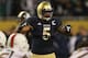 CHICAGO, IL - OCTOBER 06: Manti Te'o #5 of the Notre Dame Fighting Irish calls defensive signals against the Miami Hurricanes at Soldier Field on October 6, 2012 in Chicago, Illinois. Notre Dame defeated Miami 41-3. (Photo by Jonathan Daniel/Getty Images)