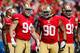 SAN FRANCISCO, CA - OCTOBER 7: Defensive tackle Justin Smith #94, nose tackle Isaac Sopoaga #90, and defensive tackle Ray McDonald #91 of the San Francisco 49ers approach the line of scrimmage against the Buffalo Bills on October 7, 2012 at Candlestick Park in San Francisco, California. The 49ers won 45-3. (Photo by Brian Bahr/Getty Images)