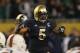CHICAGO, IL - OCTOBER 06: Manti Te'o #5 of the Notre Dame Fighting Irish calls defensive signals against the Miami Hurricanes at Soldier Field on October 6, 2012 in Chicago, Illinois. Notre Dame defeated Miami 41-3. (Photo by Jonathan Daniel/Getty Images)