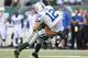 EAST RUTHERFORD, NJ - OCTOBER 14: Andrew Luck #12 of the Indianapolis Colts is tackled by LaRon Landry #12 of the New York Jets at MetLife Stadium on October 14, 2012 in East Rutherford, New Jersey. (Photo by Nick Laham/Getty Images)