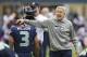 SEATTLE, WA - OCTOBER 14: Seattle Seahawks head coach Pete Carroll pats Russell Wilson #3 of the Seattle Seahawks on the head before a game against the New England Patriots at CenturyLink Field on October 14, 2012 in Seattle, Washington. (Photo by Stephen Brashear/Getty Images)