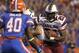 Nov 13, 2010; Gainesville, FL, USA; South Carolina Gamecocks running back Marcus Lattimore (21) runs with the ball as Florida Gators linebacker Brandon Hicks (40) defends during the first quarter of the game at Ben Hill Griffin Stadium. Mandatory Credit: Kim Klement-US PRESSWIRE