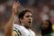 HOUSTON, TX - OCTOBER 14: Aaron Rodgers #12 of the Green Bay Packers celebrates near the bench in the fourth quarter against the Houston Texans at Reliant Stadium at Reliant Stadium on October 14, 2012 in Houston, Texas. (Photo by Scott Halleran/Getty Images)