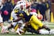 October 13, 2012; Ann Arbor, MI, USA; Illinois Fighting Illini running back Donovonn Young (5) is stopped short of the first down on a fourth down play by Michigan Wolverines linebacker Kenny Demens (25) in the second quarter at Michigan Stadium. Mandatory Credit: Rick Osentoski-US PRESSWIRE