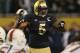 CHICAGO, IL - OCTOBER 06: Manti Te'o #5 of the Notre Dame Fighting Irish calls defensive signals against the Miami Hurricanes at Soldier Field on October 6, 2012 in Chicago, Illinois. Notre Dame defeated Miami 41-3. (Photo by Jonathan Daniel/Getty Images)