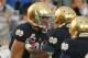 SOUTH BEND, IN - OCTOBER 13: Theo Riddick #6 of the Notre Dame Fighting Irish moves to celebrate with Tyler Eifert #80 after Eifert caught a touchdown pass against the Standford Cardinal at Notre Dame Stadium on October 13, 2012 in South Bend, Indiana. Notre Dame defeated Stanford 20-13 in overtime. (Photo by Jonathan Daniel/Getty Images)