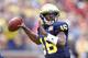 ANN ARBOR, MI - NOVEMBER 26: Denard Robinson #16 of the Michigan Wolverines throws a first quarter touchdown while playing the Ohio State Buckeyes at Michigan Stadium on November 26, 2011 in Ann Arbor, Michigan. (Photo by Gregory Shamus/Getty Images)