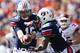 AUBURN, AL - OCTOBER 6: Clint Moseley #15 of the Auburn Tigers hands off the ball to teammate Mike Blakely #22 during a game against the Arkansas Razorbacks at Jordan-Hare Stadium on October 6, 2012 in Auburn, Alabama. The Razorbacks defeated the Tigers 24-7. (Photo by Wesley Hitt/Getty Images)