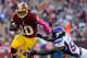 LANDOVER, MD - OCTOBER 14: Robert Griffin III #10 of the Washington Redskins is tackled by Erin Henderson #50 of the Minnesota Vikings during the first half at FedExField on October 14, 2012 in Landover, Maryland. (Photo by Patrick McDermott/Getty Images)