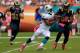 MIAMI GARDENS, FL - OCTOBER 14: Reggie Bush #22 of the Miami Dolphins rushes against the St. Louis Rams at Sun Life Stadium on October 14, 2012 in Miami Gardens, Florida. (Photo by Chris Trotman/Getty Images)