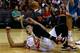 HOUSTON, TX - OCTOBER 12: Jeremy Lin #7 of the Houston Rockets sits on the court after a rough foul by Robin Lopez of the New Orleans Hornets at the Toyota Center on October 12, 2012 in Houston, Texas. NOTE TO USER: User expressly acknowledges and agrees that, by downloading and or using this photograph, User is consenting to the terms and conditions of the Getty Images License Agreement. (Photo by Scott Halleran/Getty Images)