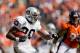 DENVER, CO - SEPTEMBER 30: Running back Darren McFadden #20 of the Oakland Raiders runs with the football as defensive tackle Derek Wolfe #95 of the Denver Broncos looks to make the tackle during the second quarter at Sports Authority Field Field at Mile High on September 30, 2012 in Denver, Colorado. (Photo by Justin Edmonds/Getty Images)