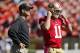 SAN FRANCISCO, CA - OCTOBER 7: Head coach Jim Harbaugh and quarterback Alex Smith #11 of the San Francisco 49ers prepare before a game against the Buffalo Bills on October 7, 2012 at Candlestick Park in San Francisco, California. The 49ers won 45-3. (Photo by Brian Bahr/Getty Images)