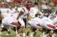 September 13, 2012; Tampa, FL, USA; Rutgers Scarlet Knights quarterback Gary Nova (15) calls a play against the South Florida Bulls during the first quarter at Raymond James Stadium. Mandatory Credit: Kim Klement-US PRESSWIRE