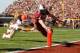 COLUMBIA, SC - NOVEMBER 12: Connor Shaw #14 of the South Carolina Gamecocks dives for a touchdown as Josh Evans #24 of the Florida Gators tries to make a tackle during their game at Williams-Brice Stadium on November 12, 2011 in Columbia, South Carolina. (Photo by Streeter Lecka/Getty Images)
