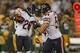 GREEN BAY, WI - SEPTEMBER 13: Tim Jennings #26 of the Chicago Bears celebrates an interception with Brian Urlacher #54 against the Green Bay Packers at Lambeau Field on September 13, 2012 in Green Bay, Wisconsin. The Packers defeated the Bears 23-10. (Photo by Jonathan Daniel/Getty Images)