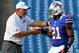 Aug. 9, 2012; Orchard Park, NY, USA; Buffalo Bills head coach Chan Gailey and defensive back Leodis McKelvin (21) before a game against the Washington Redskins at Ralph Wilson Stadium. Mandatory Credit: Timothy T. Ludwig-US PRESSWIRE