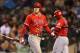 SEATTLE, WA - OCTOBER 02: Mike Trout #27 (L) of the Los Angeles Angels of Anaheim heads back to the dugout after striking out in the seventh inning against the Seattle Mariners at Safeco Field on October 2, 2012 in Seattle, Washington. (Photo by Otto Greule Jr/Getty Images)