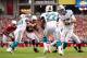 GLENDALE, AZ - SEPTEMBER 30: Quarterback Ryan Tannehill #17 of the Miami Dolphins hands off the football to running back Reggie Bush #22 during the NFL game against the Arizona Cardinals at the University of Phoenix Stadium on September 30, 2012 in Glendale, Arizona. The Carindals defeated the Dolphins 24-21 in overtime. (Photo by Christian Petersen/Getty Images)