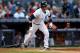 NEW YORK, NY - OCTOBER 14: Nick Swisher #33 of the New York Yankees reaches on an infield single in the second inning against the Detroit Tigers during Game Two of the American League Championship Series at Yankee Stadium on October 14, 2012 in the Bronx borough of New York City. (Photo by Elsa/Getty Images)