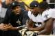 NEW ORLEANS, LA - SEPTEMBER 09: Jonathan Vilma #51 of the New Orleans Saints talks with his teammates on the bench during the game against the Washington Redskins during the season opener at Mercedes-Benz Superdome on September 9, 2012 in New Orleans, Louisiana. (Photo by Chris Graythen/Getty Images)