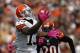 CLEVELAND, OH - OCTOBER 14: Wide receiver Josh Gordon #13 of the Cleveland Browns catches a touchdown pass in front of safety Reggie Nelson of the Cincinnati Bengals at Cleveland Browns Stadium on October 14, 2012 in Cleveland, Ohio. (Photo by Matt Sullivan/Getty Images)