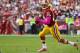 October 14, 2012; Landover, MD, USA; Washington Redskins quarterback Robert Griffin III (10) prepares to throw the ball as Minnesota Vikings outside linebacker Erin Henderson (50) chases in the first quarter at FedEx Field. The Redskins won 38-26. Mandatory Credit: Geoff Burke-US PRESSWIRE
