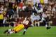 LANDOVER, MD - OCTOBER 14: Adrian Peterson #28 of the Minnesota Vikings avoids a tackle by Richard Crawford #39 of the Washington Redskins during the second half at FedExField on October 14, 2012 in Landover, Maryland. (Photo by Patrick McDermott/Getty Images)