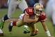 SAN FRANCISCO, CA - OCTOBER 18: Alex Smith #11 of the San Francisco 49ers scrambles for a two yard gain pursued by Chris Clemons #91 of the Seattle Seahawks during the first quarter of an NFL football game at Candlestick Park on October 18, 2012 in San Francisco, California. (Photo by Thearon W. Henderson/Getty Images)