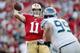 SAN FRANCISCO, CA - OCTOBER 18: Quarterback Alex Smith #11 of the San Francisco 49ers throws the ball out of bounds under pressure from defensive tackle Alan Branch #99 of the Seattle Seahawks in the first quarter on October 18, 2012 at Candlestick Park in San Francisco, California. (Photo by Brian Bahr/Getty Images)