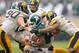 October 13, 2012; East Lansing, MI, USA; Michigan State Spartans running back Le'Veon Bell (24) is tackledIowa Hawkeyes linebacker James Morris (44) during 2nd half of a game at Spartan Stadium. Iowa won 19-16 in overtime. Mandatory Credit: Mike Carter-US PRESSWIRE