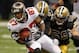 NEW ORLEANS, LA - NOVEMBER 06: Teammates Leigh Torrence #24 of the New Orleans Saints and Scott Shanle #58 try to tackle Preston Parker #87 of the Tampa Bay Buccaneers during their game at Mercedes-Benz Superdome on November 6, 2011 in New Orleans, Louisiana. (Photo by Streeter Lecka/Getty Images)