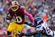 LANDOVER, MD - OCTOBER 14: Robert Griffin III #10 of the Washington Redskins is tackled by Erin Henderson #50 of the Minnesota Vikings during the first half at FedExField on October 14, 2012 in Landover, Maryland. (Photo by Patrick McDermott/Getty Images)