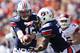 AUBURN, AL - OCTOBER 6: Clint Moseley #15 of the Auburn Tigers hands off the ball to teammate Mike Blakely #22 during a game against the Arkansas Razorbacks at Jordan-Hare Stadium on October 6, 2012 in Auburn, Alabama. The Razorbacks defeated the Tigers 24-7. (Photo by Wesley Hitt/Getty Images)