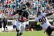 JACKSONVILLE, FL - OCTOBER 07: Maurice Jones-Drew #32 of the Jacksonville Jaguars runs past Julius Peppers #90 of the Chicago Bears during the game at EverBank Field on October 7, 2012 in Jacksonville, Florida. (Photo by Sam Greenwood/Getty Images)