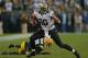 GREEN BAY, WI - SEPTEMBER 30: Jimmy Graham #80 of the New Orleans Saints moves around Charles Woodson #21 of the Green Bay Packers at Lambeau Field on September 30, 2012 in Green Bay, Wisconsin. The Packers defeated the Saints 28-27. (Photo by Jonathan Daniel/Getty Images)