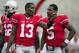 September 8, 2012; Columbus, OH, USA; Ohio State Buckeyes quarterback Kenny Guiton (13) talks with quarterback Braxton Miller (5) before their game against the UCF Knights at Ohio Stadium. Mandatory Credit: Greg Bartram-US PRESSWIRE