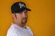 JUPITER, FL - FEBRUARY 27: Pitcher Heath Bell #21 of the Miami Marlins poses for photos during media day at Roger Dean Stadium on February 27, 2012 in Jupiter, Florida. (Photo by Marc Serota/Getty Images)