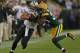 GREEN BAY, WI - SEPTEMBER 30: Jimmy Graham #80 of the New Orleans Saints fights off Tramon Williams #38 of the Green Bay Packers at Lambeau Field on September 30, 2012 in Green Bay, Wisconsin. The Packers defeated the Saints 28-27. (Photo by Jonathan Daniel/Getty Images)
